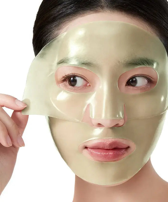 Woman applying ANUA Heartleaf 70 Soothing Collagen Mask 4pcs for skincare treatment