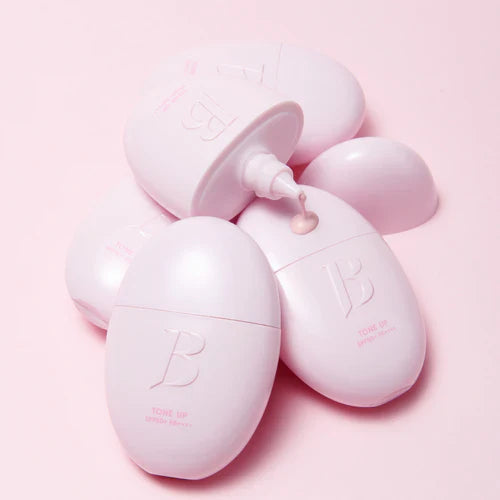 BANILACO All Day Prep Tone Up Base Cream SPF50+PA++++ pink bottles on a pink background