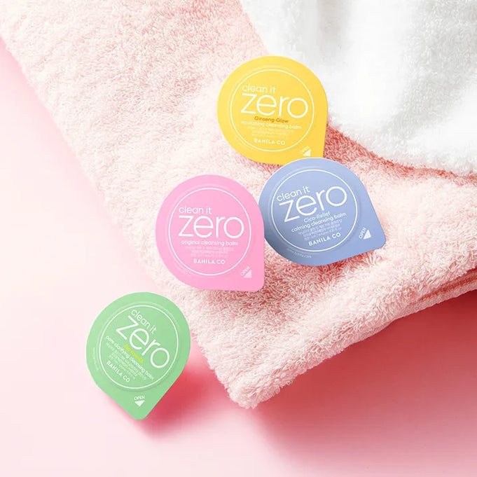 BANILA CO Clean It Zero Cleansing Balm Variety Travel Kit Duo Set with colorful balm pods on a soft pink towel
