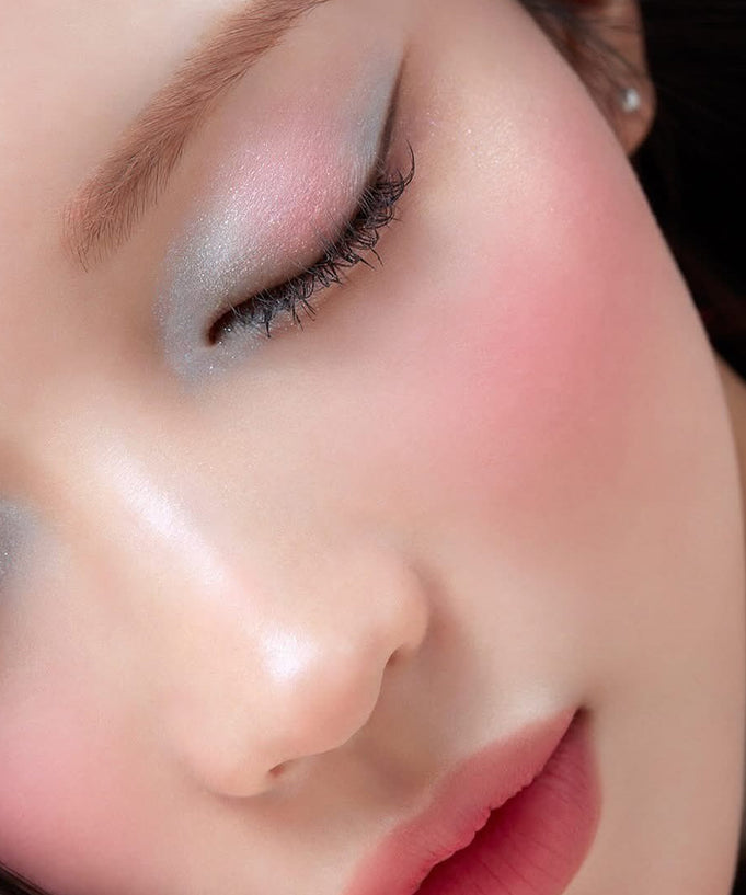 Model wearing BANILACO Hyper Holobeam Eye Glitter showcasing shimmer eyeshadow and soft pink blush.