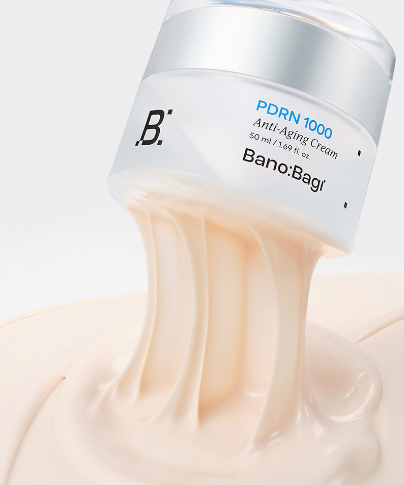 BANOBAGI PDRN 1000 Anti-Aging Cream 50ml jar with cream texture flowing out, highlighting luxurious skincare product