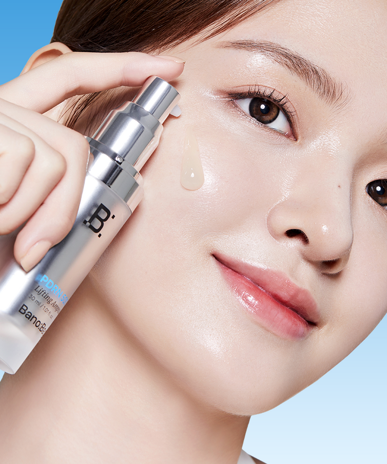 Woman applying BANOBAGI PDRN 500 Lifting Ampoule 30ml on face