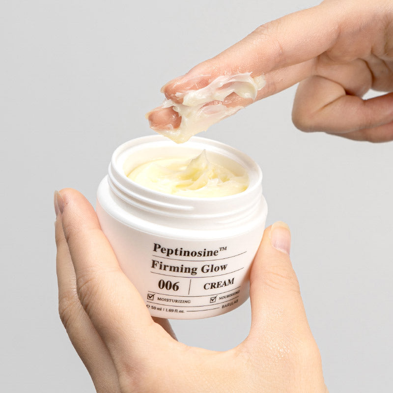 BARULAB Peptinosine Firning Glow Cream 50ml being applied by hand from an open jar