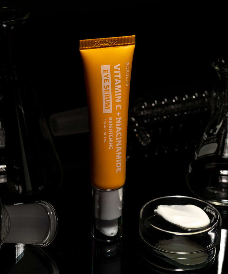 BARULAB Vitamin C Niacinamide Whitening Eye Serum 30ml on display with scientific glassware background.