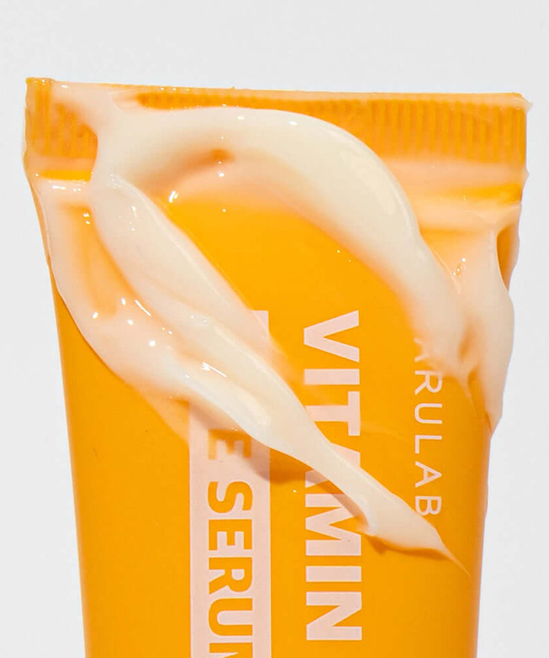 BARULAB Vitamin C Niacinamide Whitening Eye Serum 30ml with cream texture on orange tube.