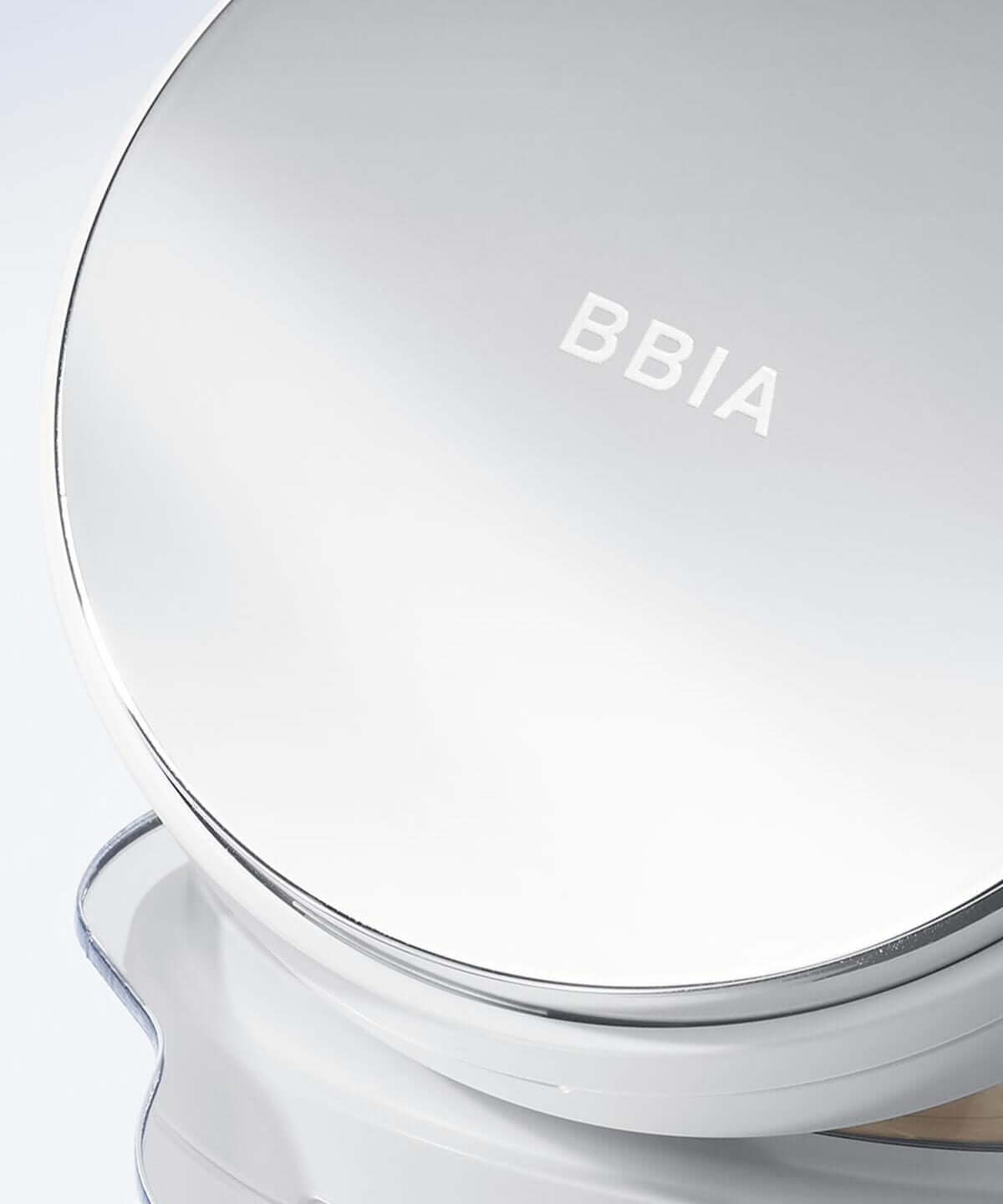 BBIA Eau Glow Cushion compact case with reflective lid on light surface