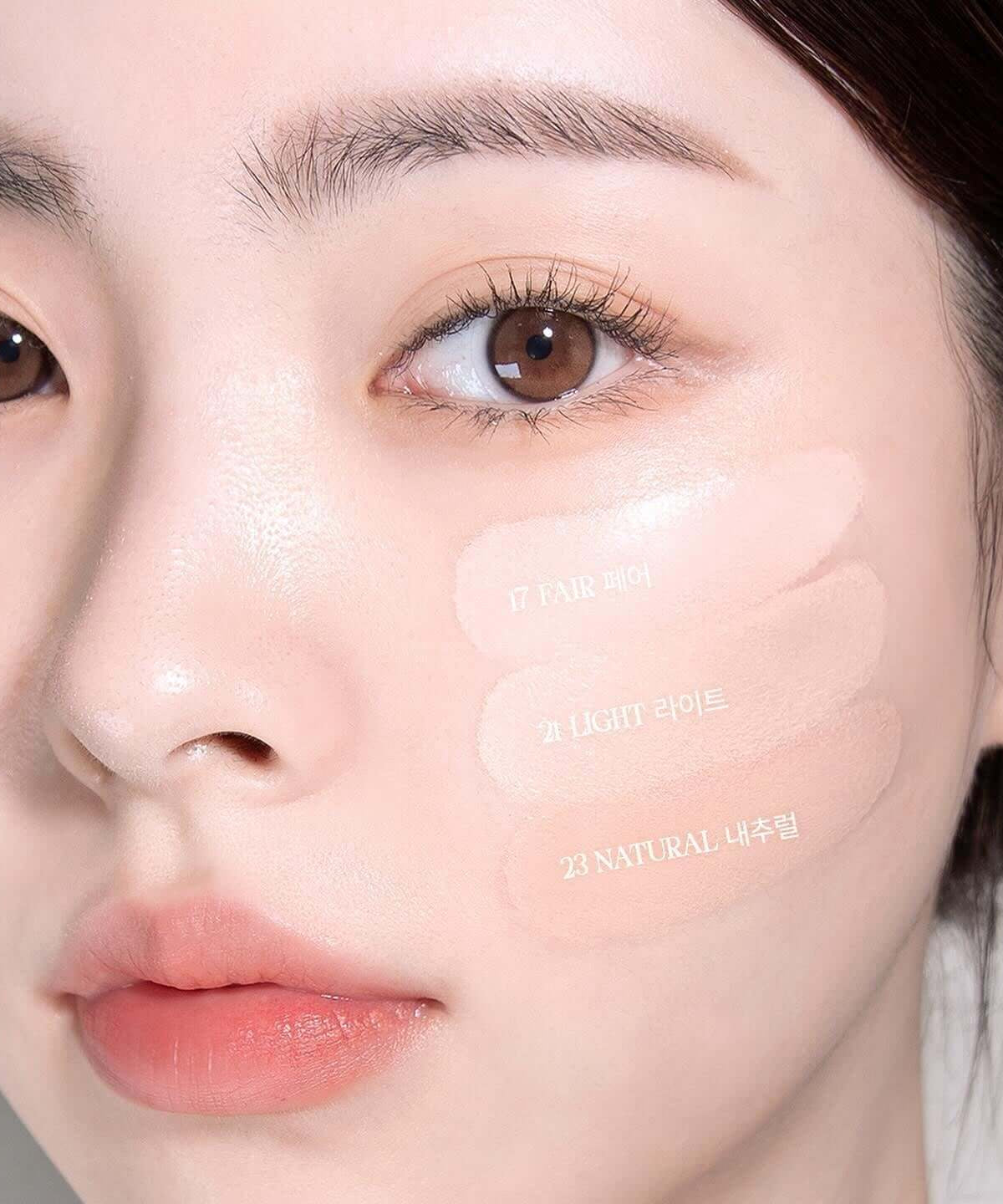 Model wearing BBIA Eau Glow Cushion with three shades on cheek for comparison