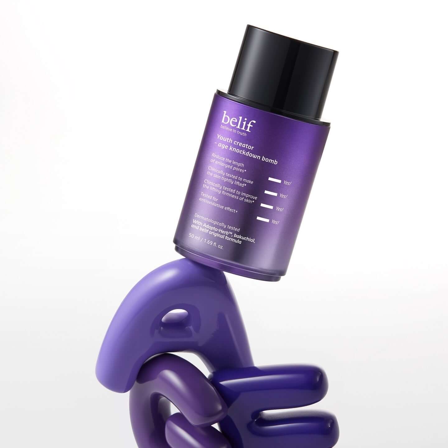 BELIF Age Knockdown Bomb Serum 50ml bottle on a unique display stand.