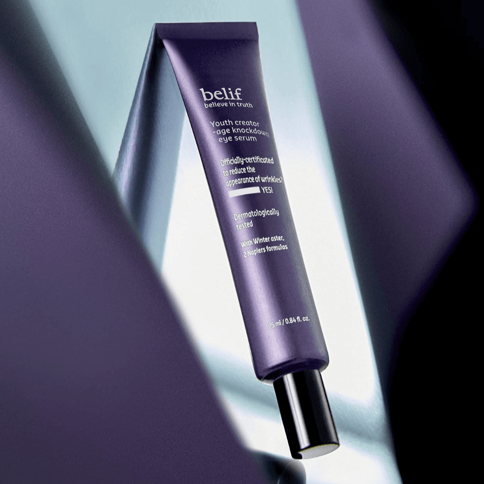 BELIF Age Knockdown V Eye Serum 25ml in sleek purple packaging, dermatologically tested for effective reduction of wrinkles.