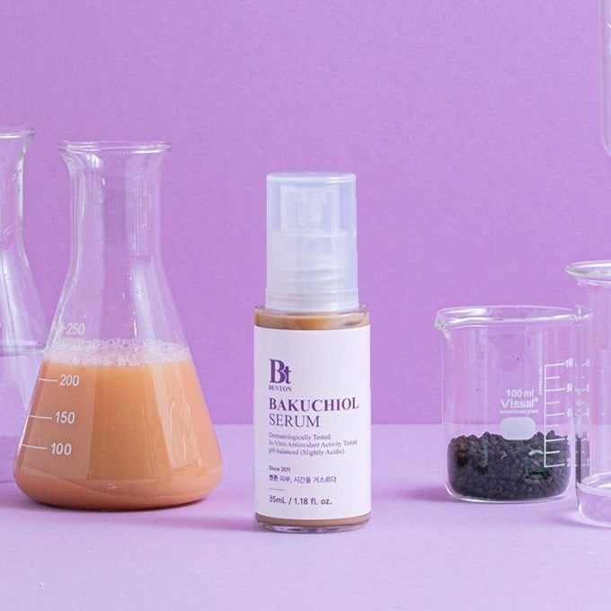 BENTON Bakuchiol Serum 35ml with scientific beakers background, showcasing skincare formulation and product packaging.