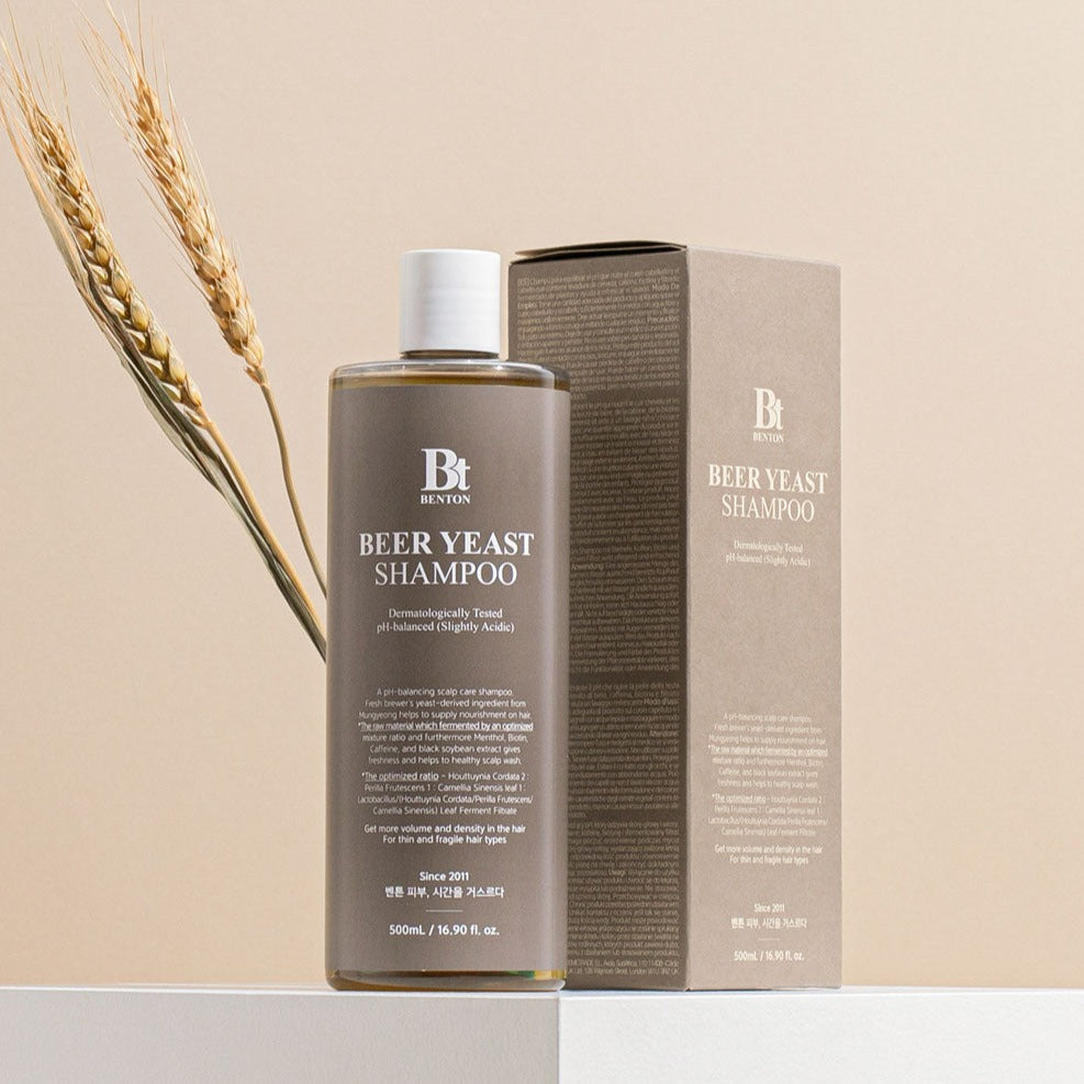 BENTON Beer Yeast Shampoo 500ml bottle and packaging with wheat stalks in the background.