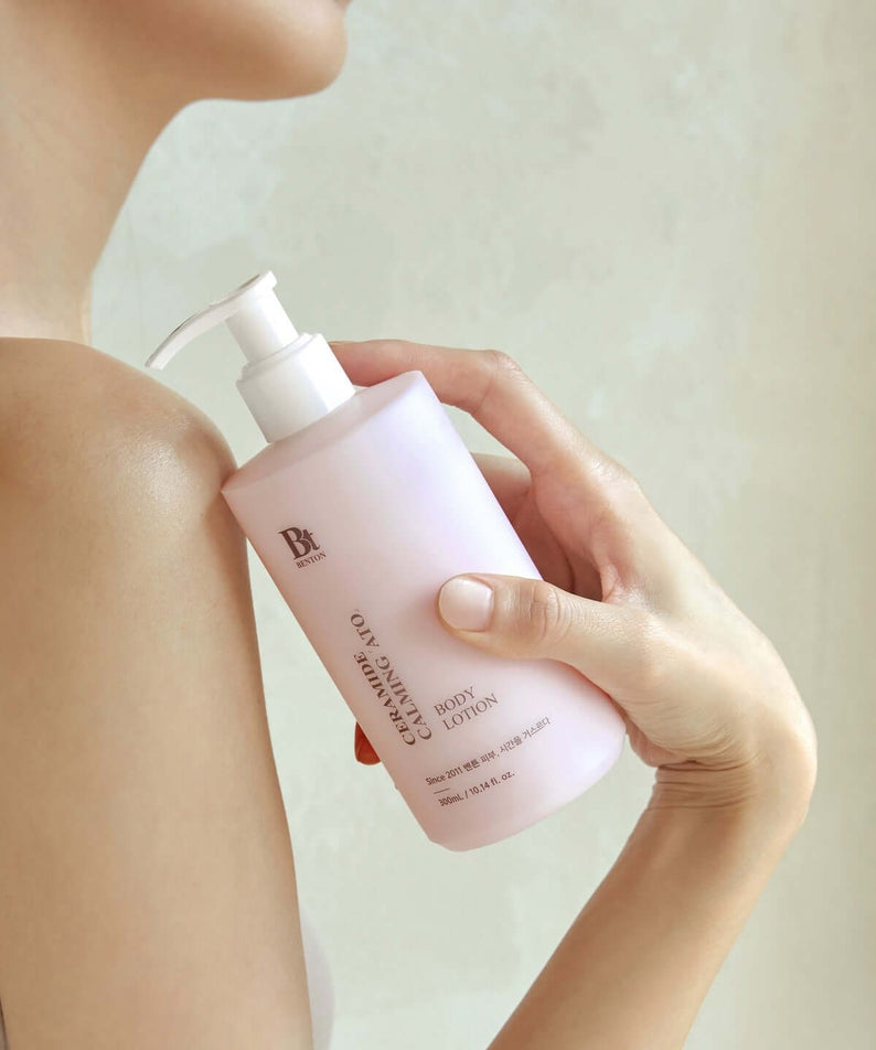 Person applying BENTON Ceramide Calming Ato Body Lotion 300ml on shoulder