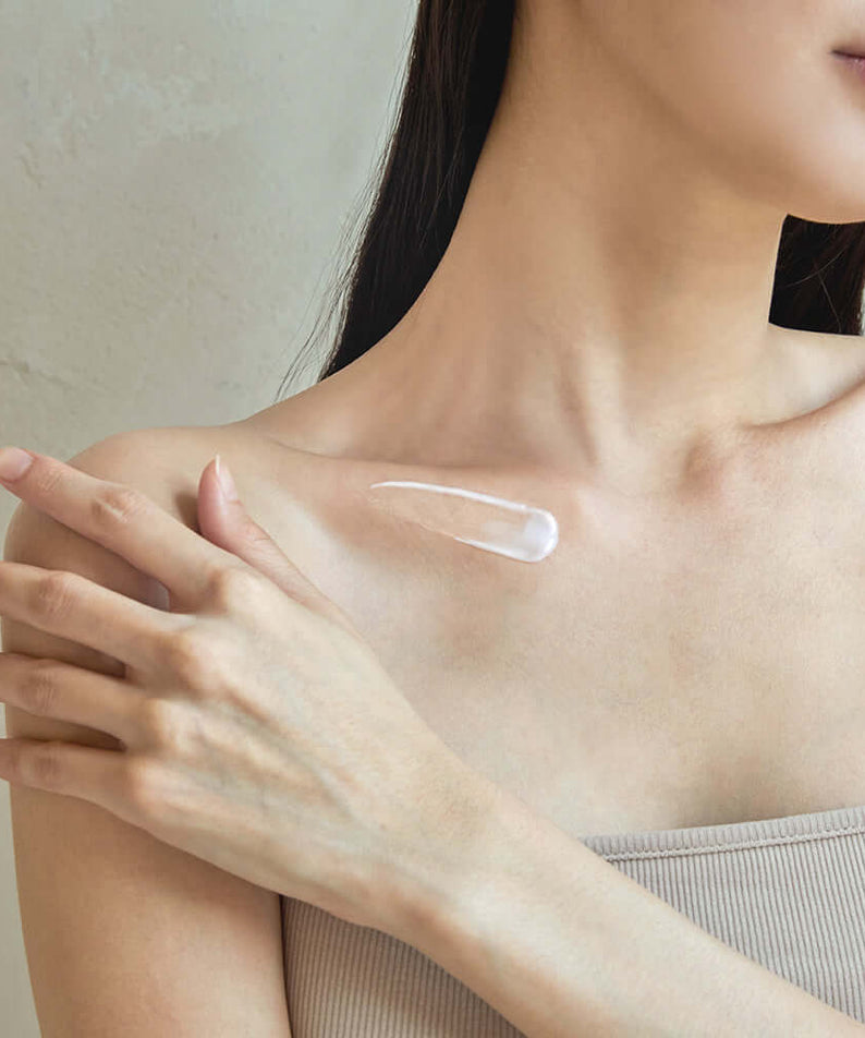 Applying BENTON Ceramide Calming Ato Body Lotion 300ml on shoulder