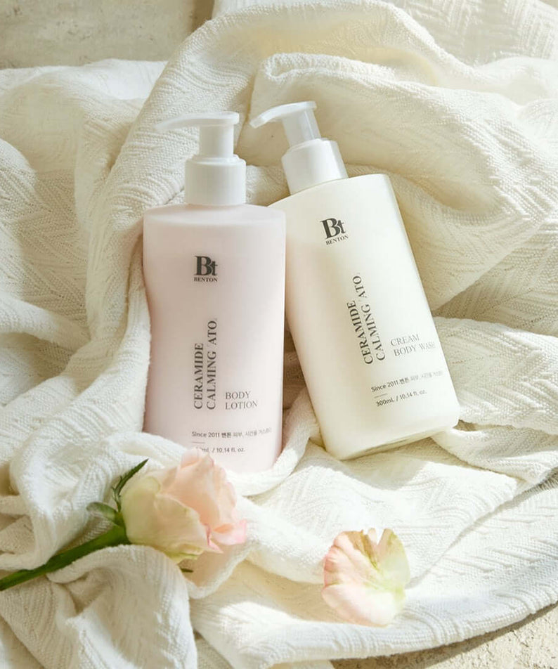 BENTON Ceramide Calming Ato Cream Body Wash 300ml and Body Lotion displayed elegantly with flowers on fabric