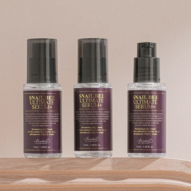 BENTON Snail Bee Ultimate Serum+ 35ml bottles on wooden surface.