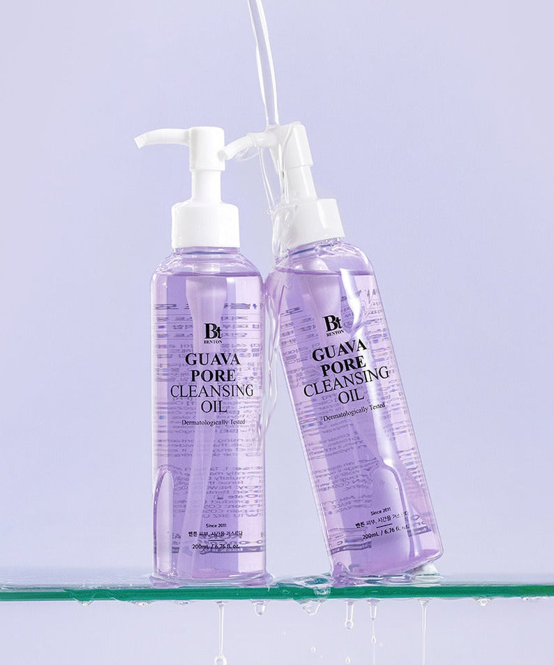 Two bottles of BENTON Guava Blackhead Pore Cleansing Oil 200ml set on a glass surface.