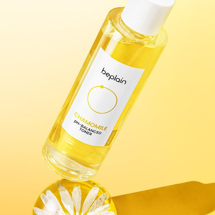 BEPLAIN Chamomile pH-Balanced Toner 200ml bottle on yellow background, showcasing its packaging and chamomile flower detail.