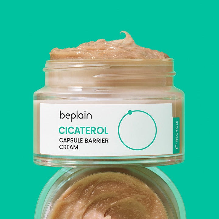 BEPLAIN Cicaterol Capsule Barrier Cream 50ml jar with open lid, showcasing cream texture against a green background.