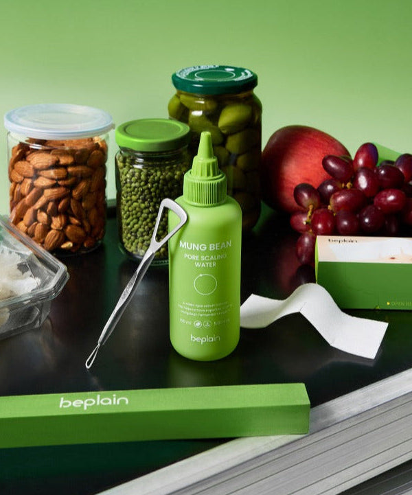 BEPLAIN Green Bean Pore Scaling Water 150ml bottle with assorted natural ingredients, featuring fresh produce and nuts.