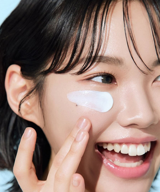 Woman applying BEPLAIN Lemon Seed Glutathione Tone-up Sun Cream 50ml for radiant skin protection