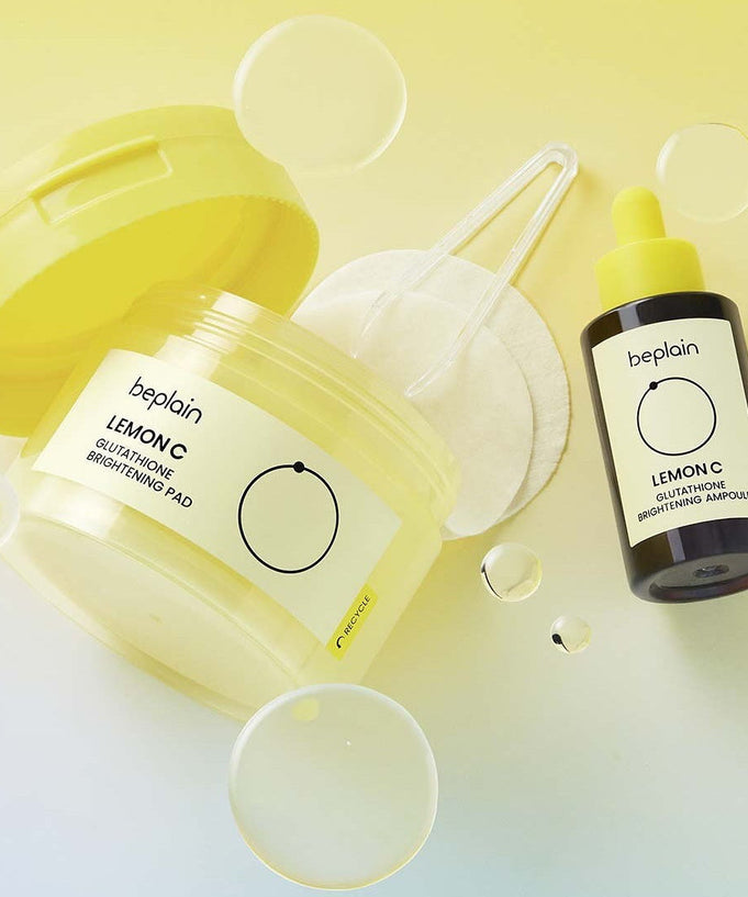 BEPLAIN Lemon Seed Glutathione Whitenning Pads 70 Sheets shown with yellow packaging and liquid bottle on light background.