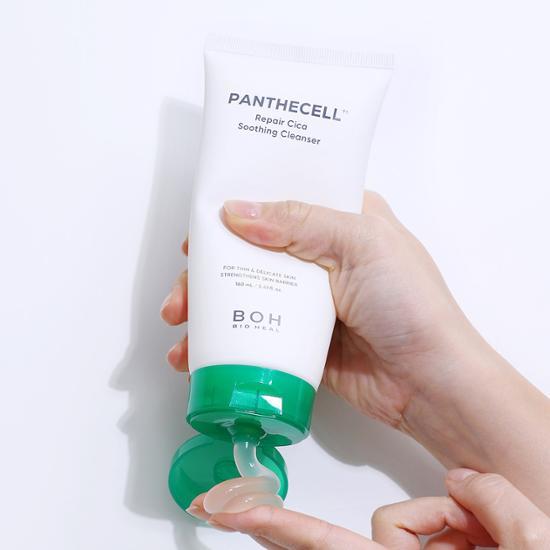 Person using BIO HEAL BOH Panthecell Repair Cica Soothing Cleanser 160mL with green cap.