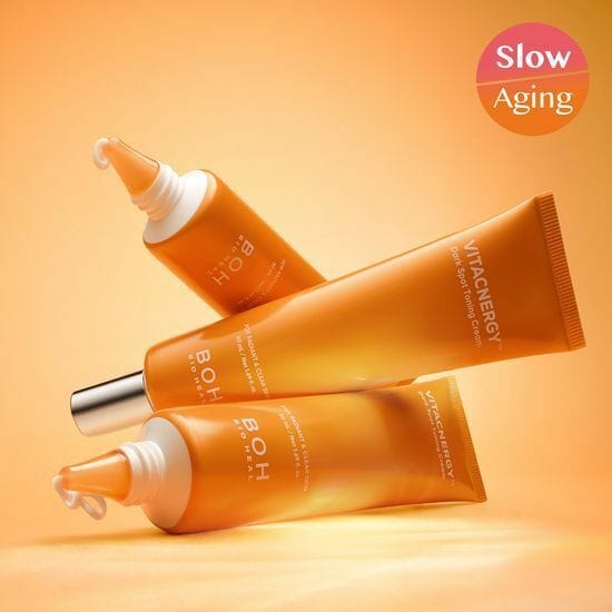 BIO HEAL BOH Vita Synergy Freckle Toning Cream 50ml in orange tubes against a vibrant background, showcasing slow aging benefits.