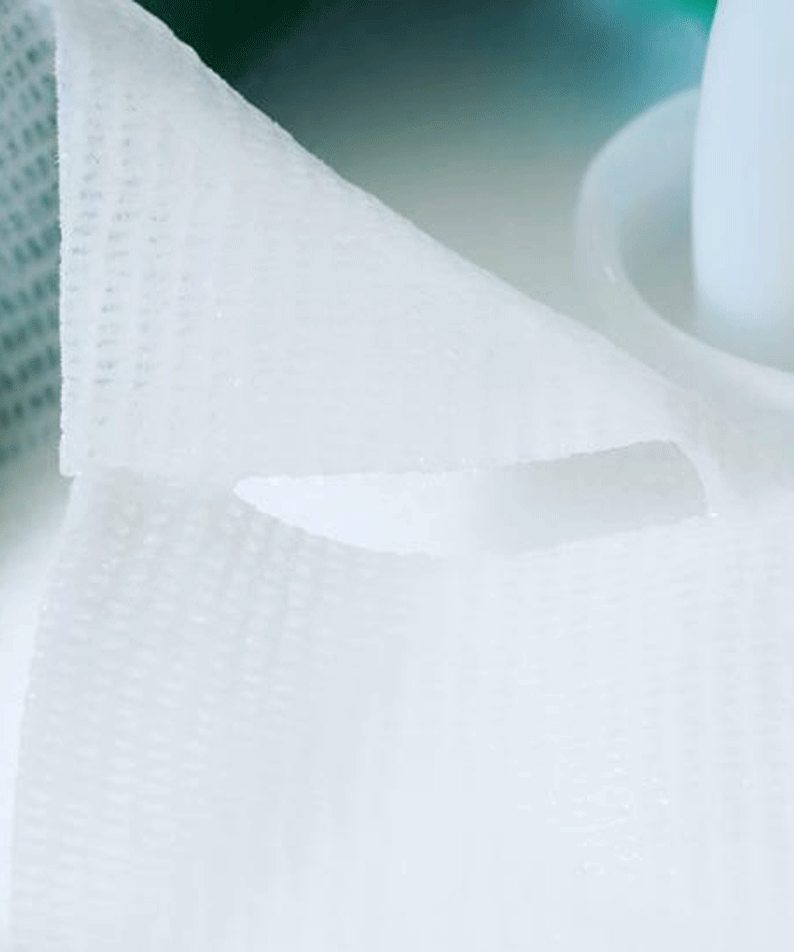 Close-up of BIO HEAL BOH Panthecell Repair Cica Gauze 80p 280ml with textured pads and visible liquid for skin treatment.