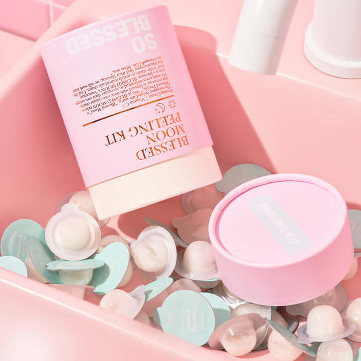 BLESSED MOON Pelling Kit in pink packaging with skincare capsules displayed on a pink background