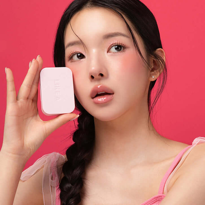 Woman holding BLESSED MOON Soap Palette against pink background