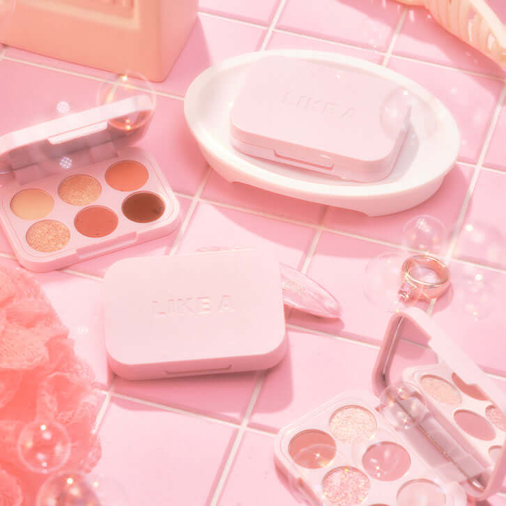 BLESSED MOON Soap Palette displayed in elegant pink packaging with various palettes and cosmetic items on a stylish pink surface.