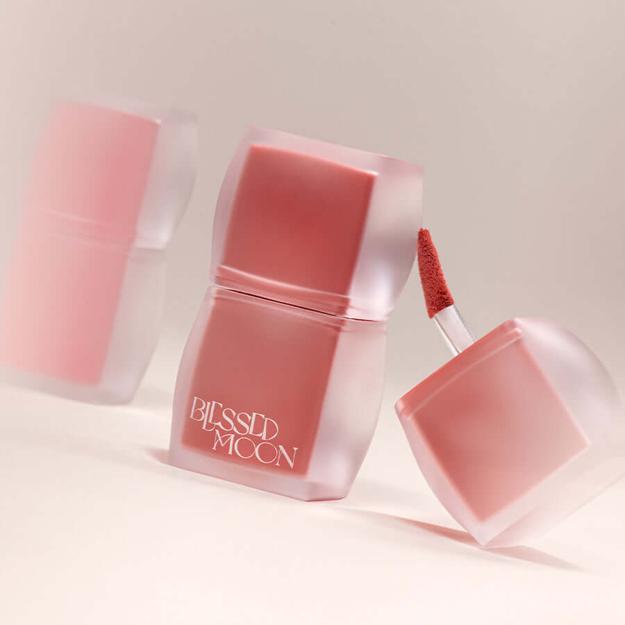 BLESSED MOON Veil Blur Lip Tint in soft focus showcasing trendy container and applicator.