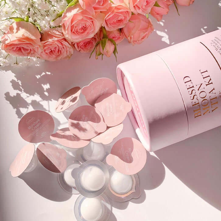 BLESSED MOON Water Kit with pink flowers and skincare capsules on a white background.