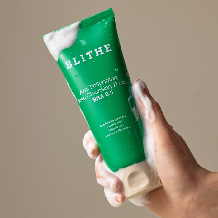 BLITHE Anti-Pollution Aging Pore Cleansing Foam BHA 0.5 150ml in hand lathered with foam, highlighting skincare benefits.