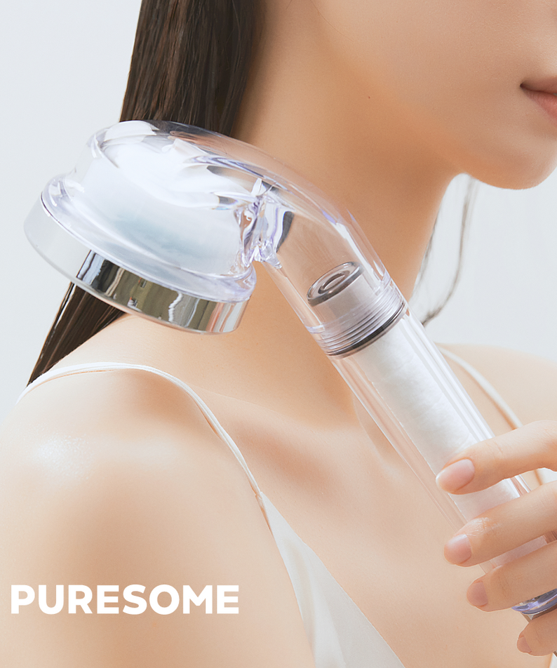 Person holding BODYLUV Vita Puresome Shower Head with clear design and modern features.