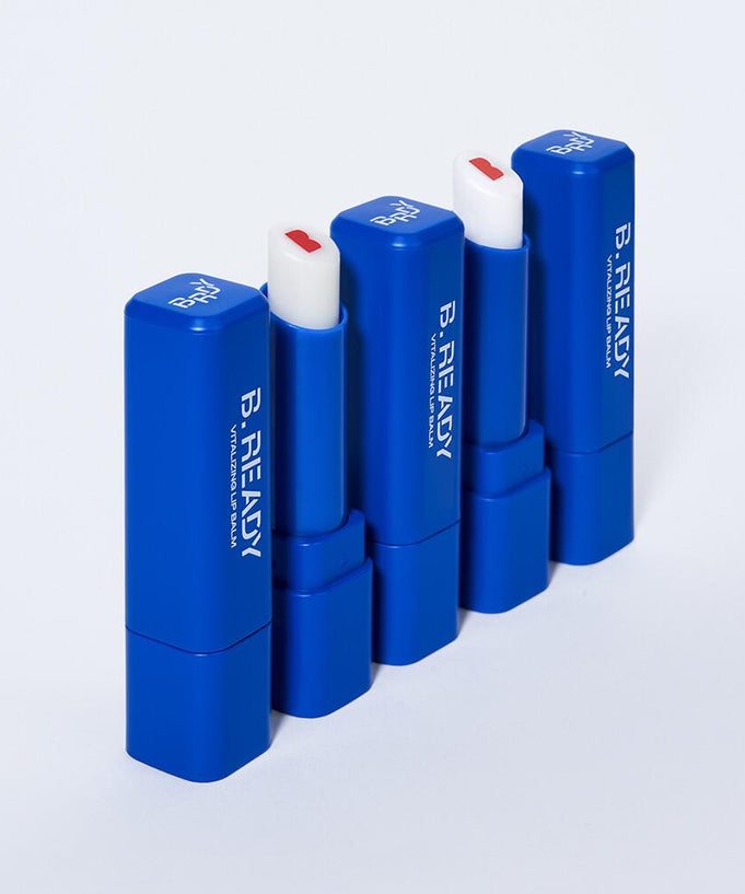 B.READY Vitalizing Lip Balm in blue packaging displayed in a row for a vibrant and nourishing lip care experience.