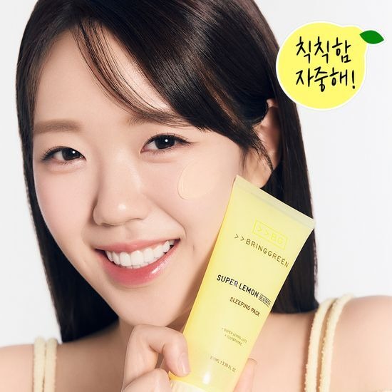 BRINGGREEN Super Lemon Glutathione Sleeping Pack 100mL held by smiling woman