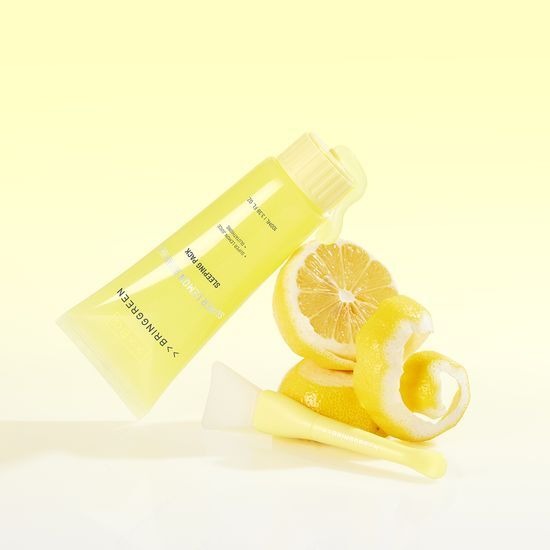 BRINGGREEN Super Lemon Glutathione Sleeping Pack 100mL with fresh lemon and applicator brush on a yellow background.
