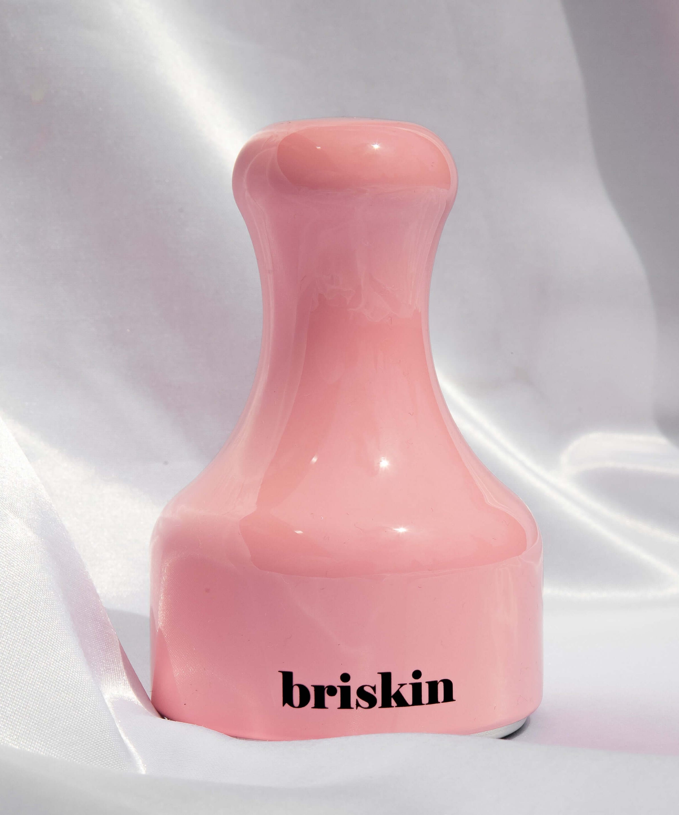 BRISKIN Face & Body Calming Ice Therapy pink tool on fabric