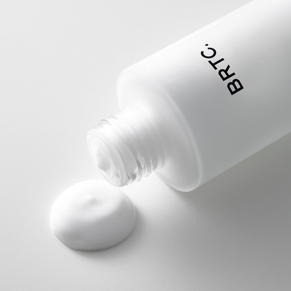 BRTC The First Emulsion 120ml bottle with cream texture on white background