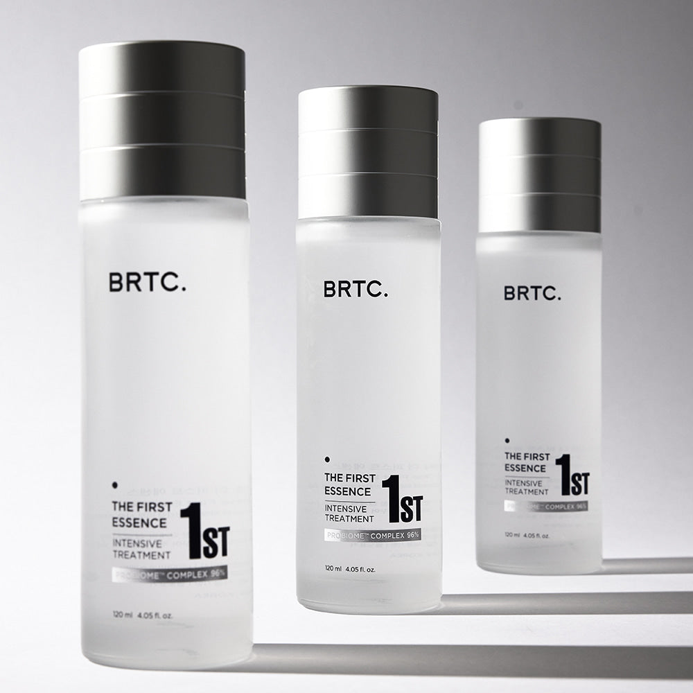 BRTC The First Essence 120ml bottles for intensive skin treatment displayed elegantly.