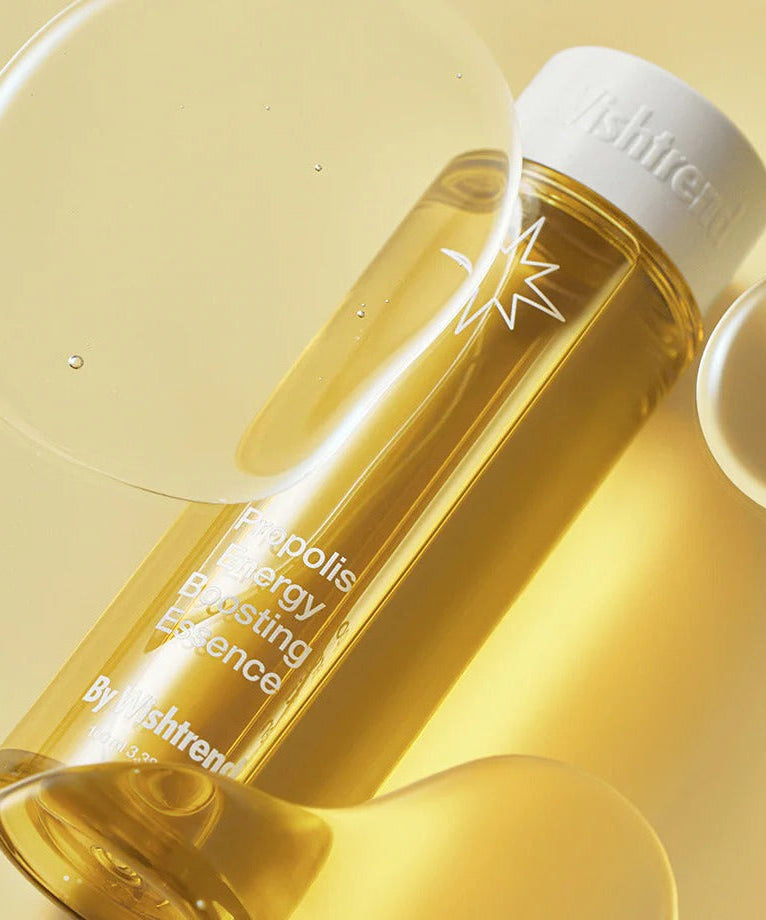 BY WISHTREND Propolis Energy Boosting Essence 100ml bottle with propolis extract on a yellow background