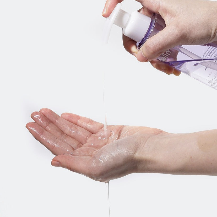 Person using CELIMAX Derma Nature Fresh Blackhead Jojoba Cleansing Oil 150ml on hands