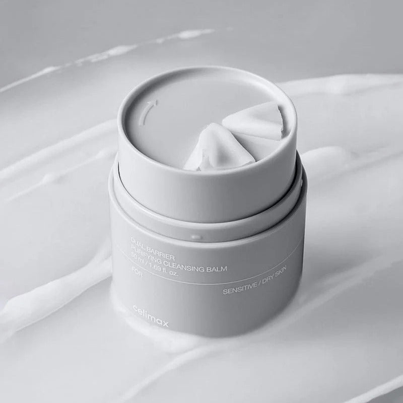 CELIMAX Dual Barrier Purifying Cleansing Balm 50ml on a textured surface, highlighting its sensitive skin-friendly formula.