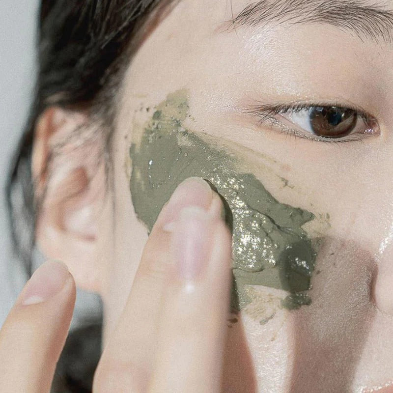 Person applying CELIMAX The Real Noni Refresh Clay Mask 120g