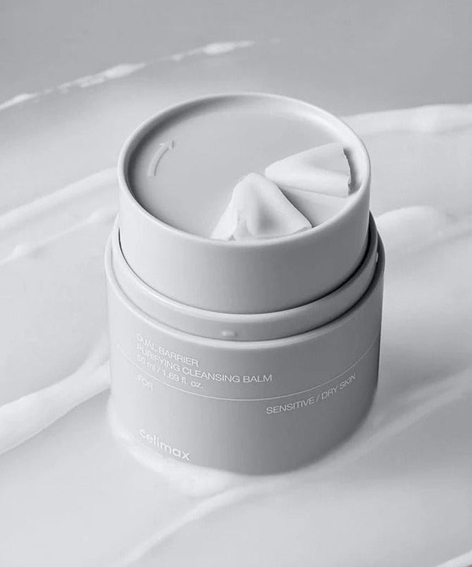 CELIMAX Dual Barrier Purifying Cleansing Balm 50ml on a textured surface, highlighting its sensitive skin-friendly formula.