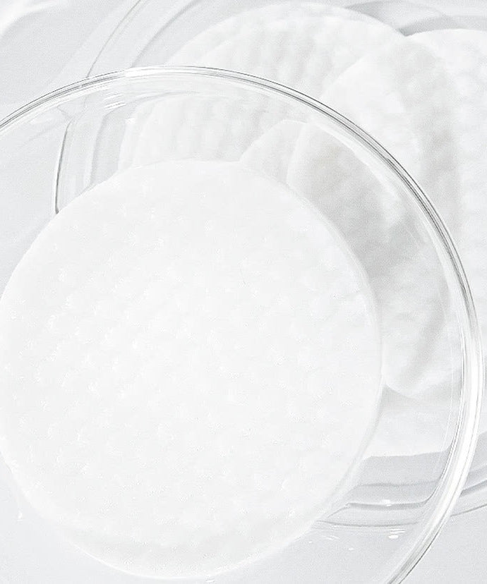 CELIMAX Ji Woo Gae One Step Body Brightening Pad 60 Pads in glass container showcasing texture