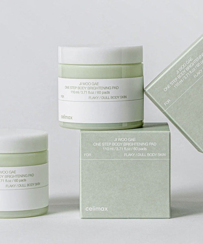 CELIMAX Ji Woo Gae One Step Body Brightening Pad 60 Pads displayed in jars and box packaging on a light background.