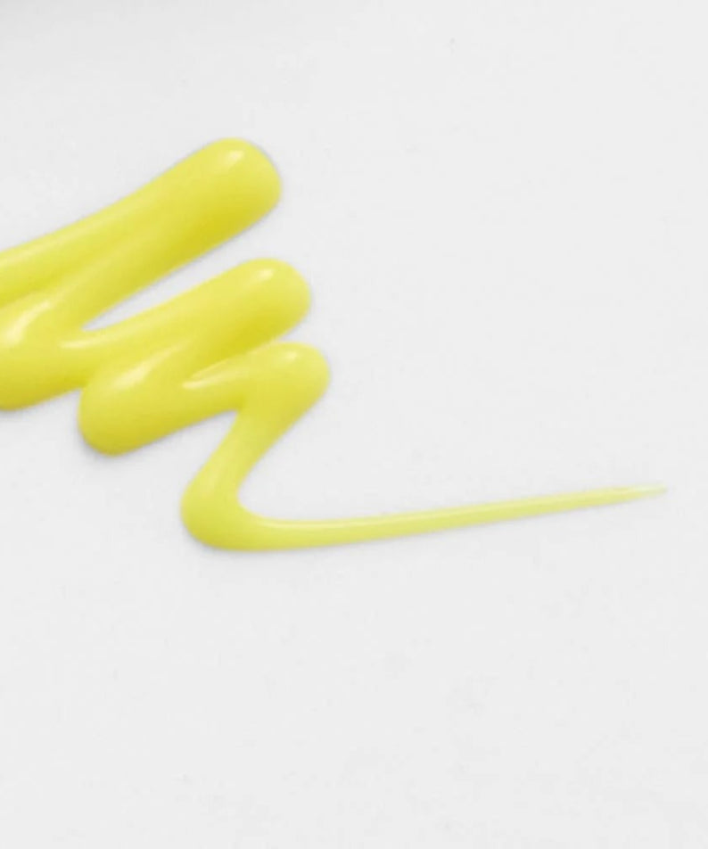 Texture of CELIMAX Retinol Shot Tightening Booster 15ml against white background.