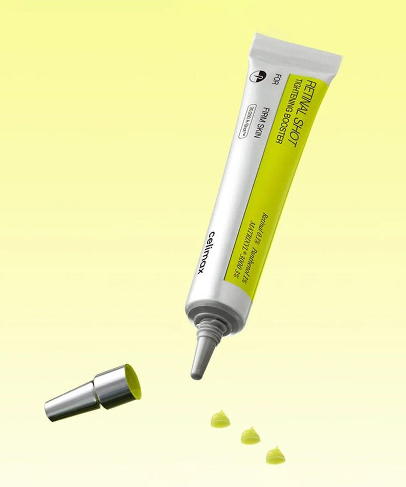 CELIMAX Retinol Shot Tightening Booster 15ml tube with open cap on yellow background